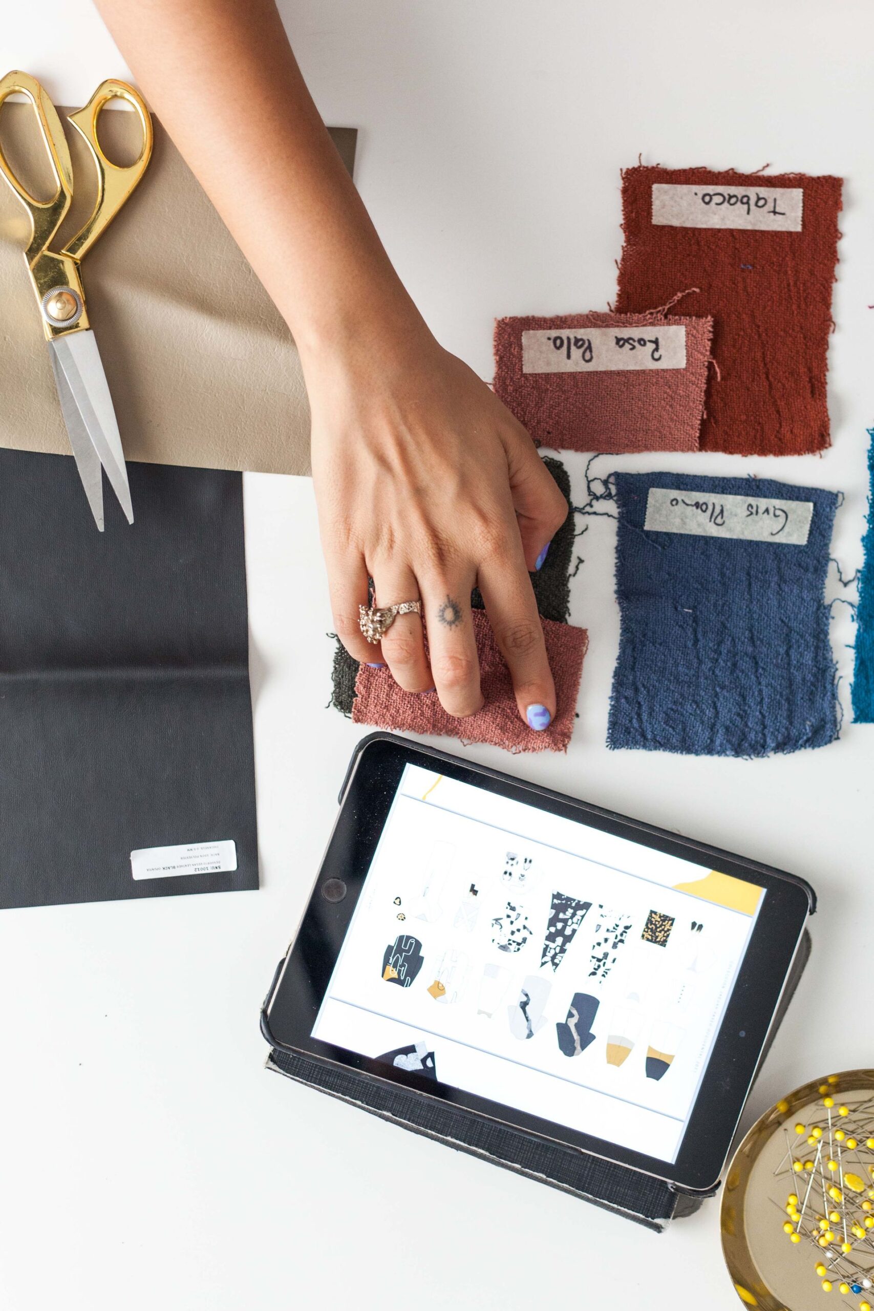 Services Flatlay of fabric swatches and creative sketches